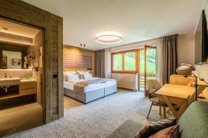 Postel nebo postele na pokoji v ubytování Hotel OTP Birkenhof