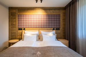 Postel nebo postele na pokoji v ubytování Hotel OTP Birkenhof