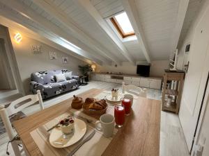 a living room with a table and a couch at Aquadolce in Baveno