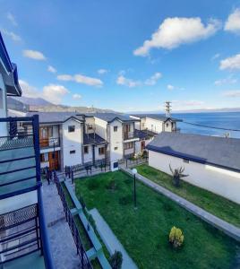 an aerial view of a house with a yard at Balcones del Beagle Apart in Ushuaia