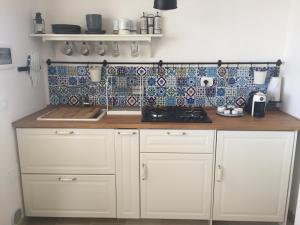 A kitchen or kitchenette at RIFUGIO Salentro