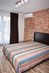 Postel nebo postele na pokoji v ubytování Zalu street apartment 37A