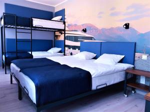 a bedroom with two bunk beds and a ship at Hostel Annamarie in Szczecin