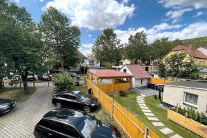a house with two cars parked in a driveway at AR Apartments III I 4 Pers I Modern I Schillerapartment in Rudolstadt