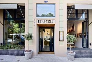a entrance to a building with a sign on the door at Hotel Brummell in Barcelona