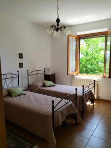 A bed or beds in a room at L'oca Nera
