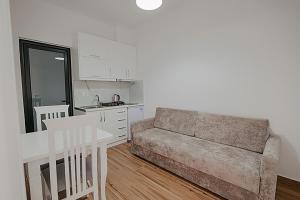 a living room with a couch and a table at Vila Muka in Ksamil +118 photos