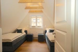 Ένα ή περισσότερα κρεβάτια σε δωμάτιο στο Ferienhaus am Schleswiger Dom Lütt Huus