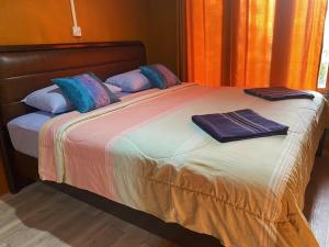 Postel nebo postele na pokoji v ubytování Patcharin Homestay