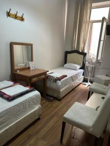 A bed or beds in a room at Hotel Hoyuk
