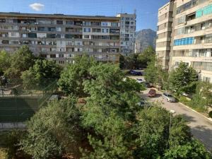 a view of a city with buildings and trees at Vintage Vibes - Family Flat in a Quiet Area in Sliven