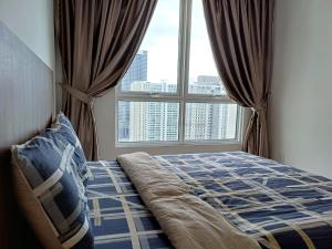 a bedroom with a bed and a large window at Mansion One Seaview 2Bedroom 2Bathroom Georgetown Gleneagles Penang By AmrayHomes in George Town