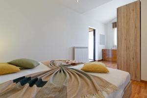 Postel nebo postele na pokoji v ubytování Holiday Home Brajdice by Rent Istria