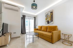 a living room with a couch and a table at Ocean Boulevard Tenerife in San Miguel de Abona