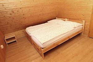 A bed or beds in a room at Chata Soňa