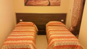 Postel nebo postele na pokoji v ubytování B&B FreeZone