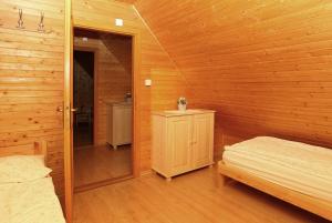 A bed or beds in a room at Chata Soňa