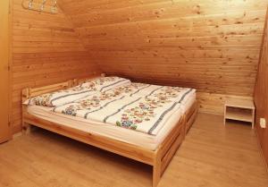 A bed or beds in a room at Chata Soňa