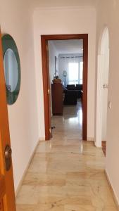 a hallway with a wooden floor in a room at Benalmarina Sea View Apartments in Benalmádena