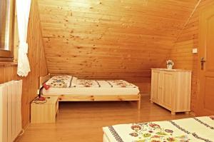 A bed or beds in a room at Chata Soňa