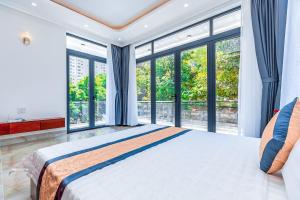Postel nebo postele na pokoji v ubytování Blue Sea Villa Vũng Tàu 2 + 19 fotografií