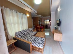 a living room with a couch and a table at Maili 6 Private Apartments in Moshi