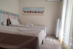 Postel nebo postele na pokoji v ubytování Villa Demy