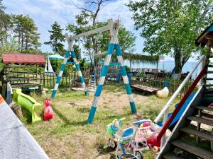 a playground with many different types of play equipment at First Sea Line Apartment FLORA, next to the beach in Pomorie