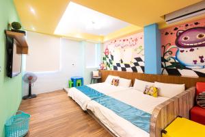 Ένα ή περισσότερα κρεβάτια σε δωμάτιο στο Fun Kids B&B