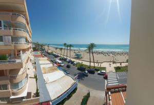 a view of the beach from a building at App.Pradomar Peñiscola in Peniscola