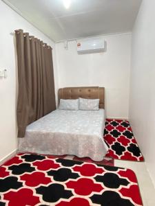 Ένα ή περισσότερα κρεβάτια σε δωμάτιο στο ELLY HOMESTAY