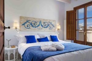 Postel nebo postele na pokoji v ubytování StayCatalina Boutique Hotel-Apartments