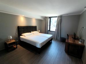 Rúm í herbergi á Hotel Enjoy Pucón