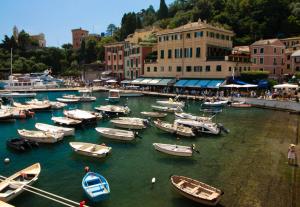 a group of boats in the water in a harbor at Blue by PortofinoHomes in Portofino