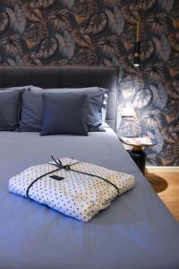 Ένα ή περισσότερα κρεβάτια σε δωμάτιο στο Nuova Cafe' Suite