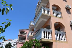 a building with balconies on the side of it at Apartments Lavanda in Crikvenica