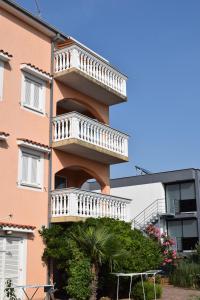 a building with a staircase on the side of it at Apartments Lavanda in Crikvenica