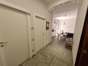 a hallway with a door and a dining room at Costa del Sole in Salerno +40 photos
