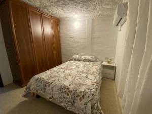 A bed or beds in a room at La Posada Manabita