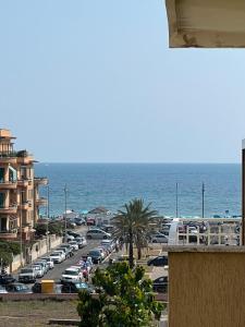 a view of a parking lot next to the ocean at All'85, Lido di Ostia, Roma in Lido di Ostia