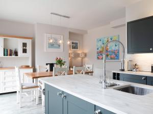 a kitchen with a sink and a counter top at Celadon in Dartmouth