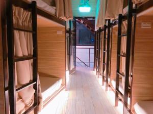 a row of bunk beds in a room at 九窩Jiu Wow Box Inn Jiufen九份 in Jiufen