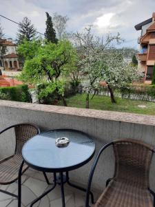 a table and two chairs sitting on a balcony at Studio Vrnjci 961 in Vrnjačka Banja