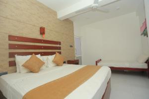 Tempat tidur dalam kamar di Siyona Hotel