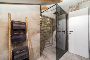 a bathroom with a shower and a glass door at Luxury Villa Cortile in Benkovac +53 photos