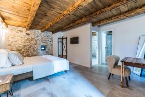 a bedroom with a bed and a desk at Luxury Villa Cortile in Benkovac
