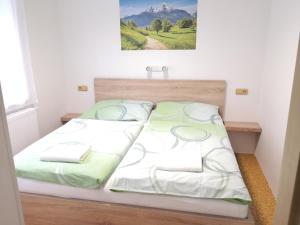 Postel nebo postele na pokoji v ubytování Penzion Zelená zahrada