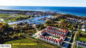 an aerial view of a town next to the water at Aravell E23 Darłówko Wschodnie in Darlowko
