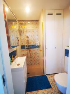 a bathroom with a shower and a sink and a toilet at Aravell E23 Darłówko Wschodnie in Darlowko +8 photos