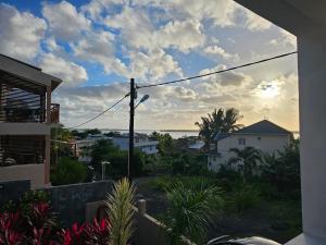 a view of the ocean from a house at Villa Trochetia in La Gaulette